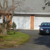 <p>A state trooper is stationed in the driveway of Peter Lanza&#x27;s home on Bartina Lane in Stamford. </p>