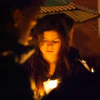 <p>A girl holds a candle at a vigil on the Village Green in Rye on Sunday night for Friday&#x27;s shooting at Sandy Hook Elementary School in Newtown, Conn.</p>