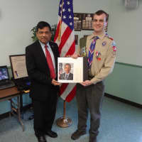 <p>Yorktown council member Vishnu Patel presented a certificate to Eagle Scout Robert Athanasidy.</p>