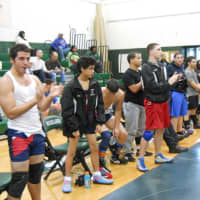 <p>The Yonkers Public Schools wrestling team applauds a teammate following a win. The team is flourishing in its sixth season under the guidance of coach Pete Vuplone.</p>