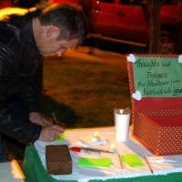 <p>Many who attended Monday&#x27;s vigil in Fairfield write notes offering sympathy and encouragement to the families of the victims.</p>
