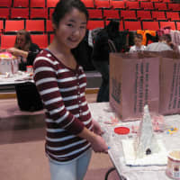 <p>Sixth-grader Sophia Pao tried her hand at the Eiffel Tower on Tuesday at the Chappaqua Library&#x27;s gingerbread house decorating event.</p>
