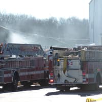 <p>Norwalk Fire Department apparatus arrives at a structure fire at D&#x27;Orio Custom Wood Works on Wilson Avenue on Wednesday.</p>