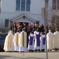 <p>Mourners watch as the body of Anne Marie Murphy is carried down the steps of St. Mary&#x27;s of the Assumption Church in Katonah. </p>