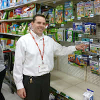 <p>Greenburgh Kmart manager Scott Reid points to LeapPad games, which he says are very popular this year.</p>