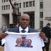 <p>Kenneth Chamberlain Jr. protests a Westchester grand jury&#x27;s May 2 decision not to indict the White Plains police officers involved in the shooting of his father.</p>
