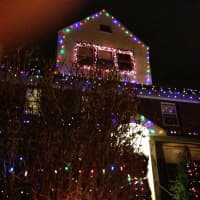 <p>Residents adorn their lawn with Christmas lights.</p>