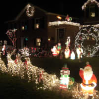 <p>Residents adorn their lawn with Christmas lights and decorations. </p>