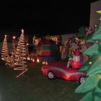 <p>Residents adorn their lawn with Christmas lights and decorations. </p>