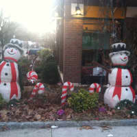 <p>Merry snowmen cavort with candy canes by Frannie&#x27;s Goodie Shop in downtown Mount Kisco.</p>