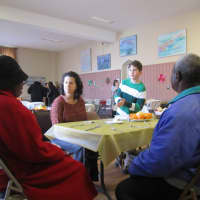 <p>Congregation Sons of Israel volunteers Natalie and Michael Gorlin help serve community members Tuesday at Ossining&#x27;s First Presbyterian Church.</p>