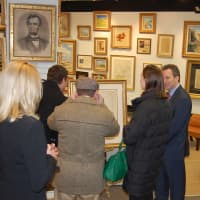 <p>Spectators enter C. Parker Gallery in Greenwich for its recent launch.</p>