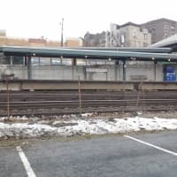 <p>Snow lines the fence of the Mount Vernon East train station.</p>
