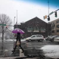 <p>Residents endure the snow on Mamaroneck Avenue in White Plains Saturday. </p>