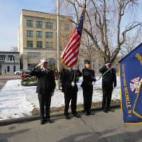 <p>New Rochelle police salute the flag.</p>
