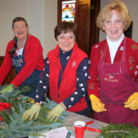 <p>From left, Pound Ridge Garden Club members Amanda Sutton, Virginia Todar and Anne Lyman make swag to decorate signposts on town roadways through the holiday season.</p>