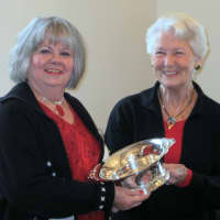 <p>Carol Cioppa, left, outgoing president of the Pound Ridge Garden Club, receives an award from Joan Goldberg, awards chair, at the clubs year end awards luncheon.</p>