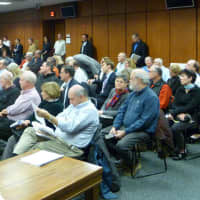 <p>A crowd of Cos Cob residents and Greenwich officials listen to the Planning and Zoning Commission&#x27;s deliberations during Tuesday&#x27;s meeting.</p>