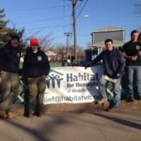 <p>Members of the Venture Crew pose in front of the Habitat for Humanity sign. From left, Matt Jones, Ted Laquidara, Stephen Muoio and Gabe Frolick.</p>