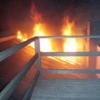 <p>Fire rips through the roof of the greenhouse at Daybreak Nurseries in Westport on Wednesday night. </p>