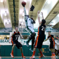 <p>Norwalk&#x27;s Saeed Soulemane puts up a shot as he&#x27;s guarded by several Ridgefield defenders.</p>
