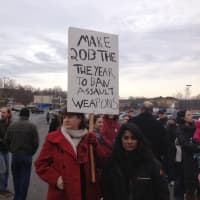<p>Jen Sage-Robison, a Bethel resident, held a sign advocating an end to gun violence outside Walmart in Danbury on Tuesday.</p>