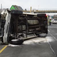 <p>Norwalk fire officials say a van flipped on its side and hit barrels used to protect a work zone on I-95 north.</p>