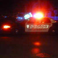 <p>Norwalk police cruisers block Blackstone Drive on Tuesday night where Officer Kenneth Cerulli fatally shot himself.</p>