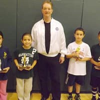 <p>From left in the 8-9 age group: runner-up Rhianna Candido, champion Allison Torres, Hoop Shoot Chairman Michael Littleton, champion Marco Landicino and runner-up Clayton Proctor.</p>