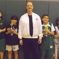 <p>From left in the 10-11 age group: runner-up Valentina Osso, champion Sierra Mancusso, Hoop Shoot Chairman Michael Littleton, champion Sebastian Cano, runner-up Dylan Chilowitz.</p>