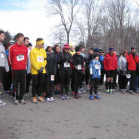 <p>Runners trying to stay warm at the starting line.</p>