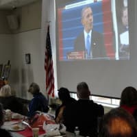 <p>Residents watch as President Barack Obama delivers his inaugural address.</p>