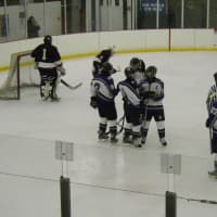 <p>New Rochelle congratulates Chris Ramondelli, #10, on the first of his three goals in a 7-4 win over Fordham Prep Monday.</p>