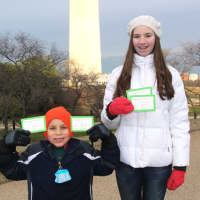<p>Nick and Nicole Mathias of Westport show off their tickets for the presidential inauguration ceremonies.</p>