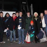 <p>The Mathias family and members of the Staples High School Young Democrats Club prepare to board a charter bus to Washington D.C. early Monday morning. </p>