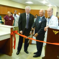 <p>From left to right, Dr. Thomas Lynch Jr., Frank Corvino and Dr. Dickerman Hollister Jr. open the renovated Bendheim Cancer Center.</p>