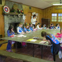 <p>Girl Scouts in Eastchester sign each others&#x27; &quot;compliment books.&quot; </p>