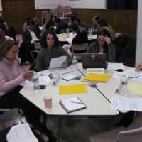 <p>Parents took part in a reading exercise to help them experience how students are assessed. </p>