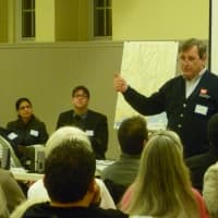 <p>Tom Hudson of the Army Corps of Engineers explains the Byram River Flooding Prevention Feasibility Study to a crowd at the Western Greenwich Civic Center on Wednesday evening.</p>
