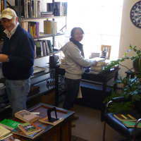 <p>Curious-on-Hudson&#x27;s Fred Dubin, left, and Sadi Rebsch do some book housekeeping in preparation for Sundays opening.</p>