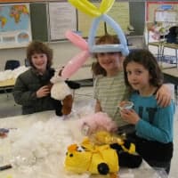 <p>From left, Spencer Nyitray, Jenna Luper and Samantha Luper took some time building stuffed animals at the &quot;Cuddly Friends&quot; station at the Lewisboro Circus.</p>