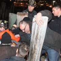 <p>Emergency service personnel take one of the victims off a rescue boat Sunday evening  after a plane crashed in the Hudson River. </p>