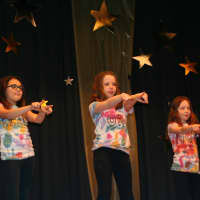 <p>Third-graders, from left, Annabelle Santucci, Sabrina Schechter and Alex Fields show off their star performance at  Pound Ridge Elementary School Cabaret Night.</p>