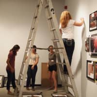 <p>Students install their own work for the Young Artists 2013 exhibition at the Katonah Museum of Art.</p>