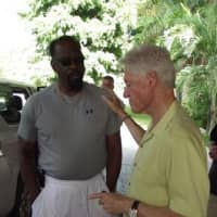 <p>Former President Bill Clinton and Jim Bostic of Yonkers talk during a recent trip to Haiti. </p>
