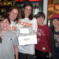 <p>From left, Westport residents Sarah Green, her son Matthew Motyl, and Lynne Goldstein with her son Ben and friend Conor Hanley show support Great Cakes Wednesday.</p>