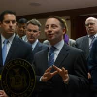 <p>County Executive Rob Astorino, center, said the county will &quot;drown&quot; if it doesn&#x27;t receive relief for unfunded mandates Thursday at Yorktown Town Hall.</p>