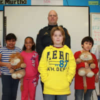 <p>Peekskill Police Officer Leo Dylewski with Peekskill fifth graders. Dylewski leads the D.A.R.E. and G.R.E.A.T. programs in the district.</p>