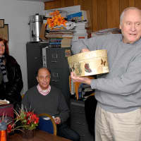 <p>Gary Kleiber, right, starts Saturday&#x27;s drawing. Looking on from L-R: Freedom Gardens Board member Mel Tanzman, a family member of an applicant, and Alan Gordon, deputy director of the Housing Action Council.</p>