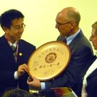 <p>A representative of the Beijing school presents a commemorative plate to Greenwich High headmaster Chris Winters during Tuesday&#x27;s cultural meeting.</p>